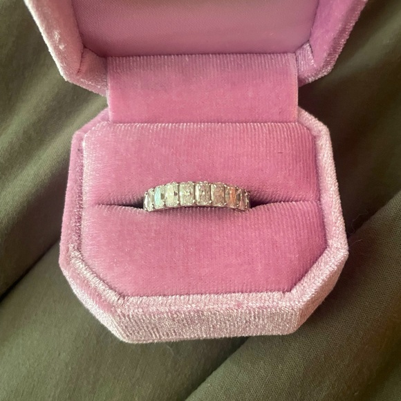 Lovely moissanite and 14k white gold radiant eternity band. Size 8.